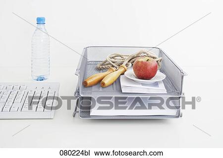 still life of rope and apple in tray on office desk View Large Photo Image Stock Image - still life of rope and apple in tray on office desk. Fotosearch