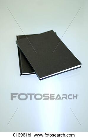 still life of two black books on table View Large Photo Image Stock Image - still life of two black books on table. Fotosearch