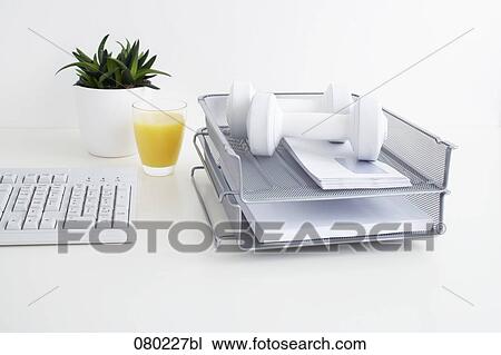 still life of two dumb bells in tray on office desk View Large Photo Image Stock Image - still life of two dumb bells in tray on office desk. Fotosearch