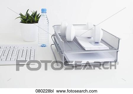 still life of two dumb bells in tray on office desk View Large Photo Image Stock Image - still life of two dumb bells in tray on office desk. Fotosearch