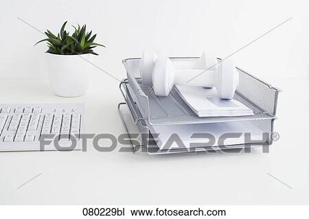 still life of two dumb bells in tray on office desk View Large Photo Image Stock Image - still life of two dumb bells in tray on office desk. Fotosearch
