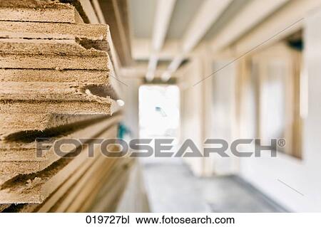 Stock Image - still life of wooden planks on construction site. Fotosearch