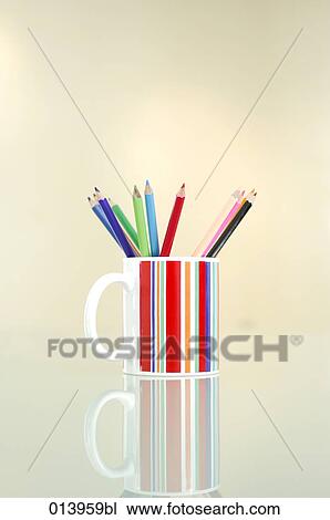 still of coloured pencils in striped cup View Large Photo Image Stock Image - still of coloured pencils in striped cup. Fotosearch