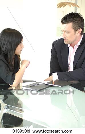 two business people having a conversation View Large Photo Image Stock Image - two business people having a conversation. Fotosearch