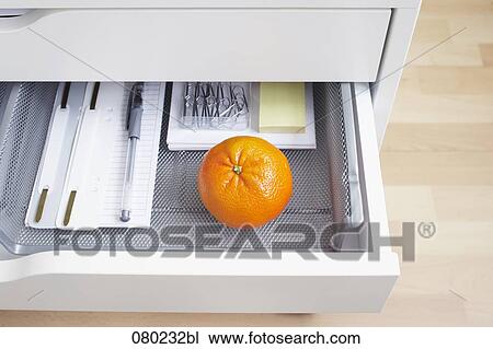 view into open desk drawer containing one orange View Large Photo Image Stock Image - view into open desk drawer containing one orange. Fotosearch