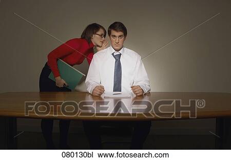 woman whispering into businessman´s ear View Large Photo Image Stock Image - woman whispering into businessman´s ear. Fotosearch