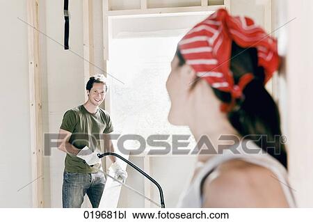 young couple on construction site smiling at each other View Large Photo Image Stock Image - young couple on construction site smiling at each other. Fotosearch