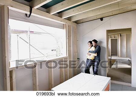 young couple on the construction site of their new home View Large Photo Image Stock Image - young couple on the construction site of their new home. Fotosearch