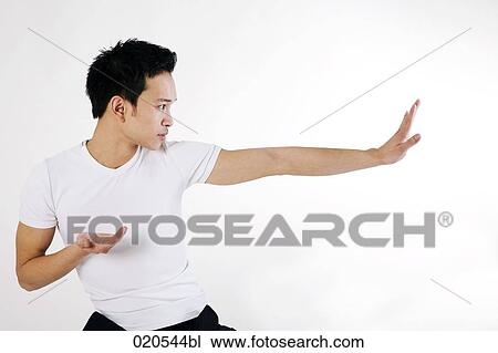 asian man doing martial arts exercises View Large Photo Image Stock Image - asian man doing martial arts exercises. Fotosearch