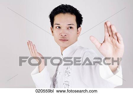 asian man doing martial arts exercises View Large Photo Image Stock Image - asian man doing martial arts exercises. Fotosearch