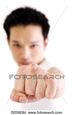 Stock Image - asian man doing martial arts exercises. Fotosearch