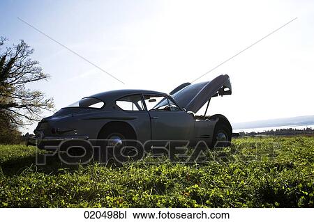 classic car with open bonnet standing on meadow View Large Photo Image Stock Image - classic car with open bonnet standing on meadow. Fotosearch