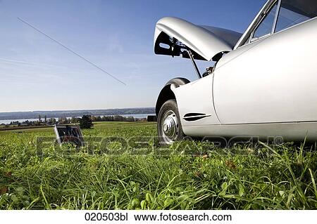 classic car with open bonnet standing on meadow View Large Photo Image Stock Image - classic car with open bonnet standing on meadow. Fotosearch