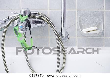 close-up of bathtub with fittings swimming goggles and soap View Large Photo Image Stock Image - close-up of bathtub with fittings swimming goggles and soap. Fotosearch