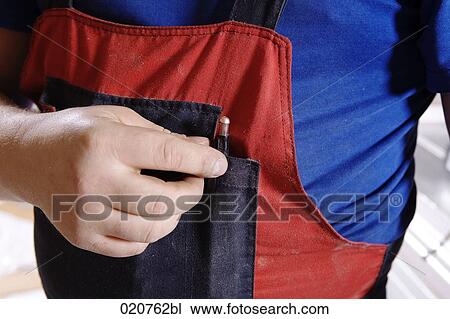 close-up of craftsman wearing dungarees View Large Photo Image Stock Image - close-up of craftsman wearing dungarees. Fotosearch