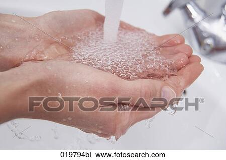 close-up of woman catching water in her hands View Large Photo Image Stock Image - close-up of woman catching water in her hands. Fotosearch