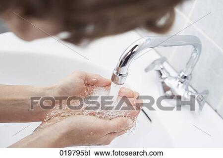 close-up of woman catching water in her hands View Large Photo Image Stock Image - close-up of woman catching water in her hands. Fotosearch