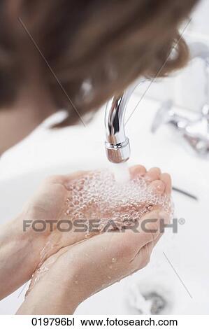 close-up of woman catching water in her hands View Large Photo Image Stock Image - close-up of woman catching water in her hands. Fotosearch