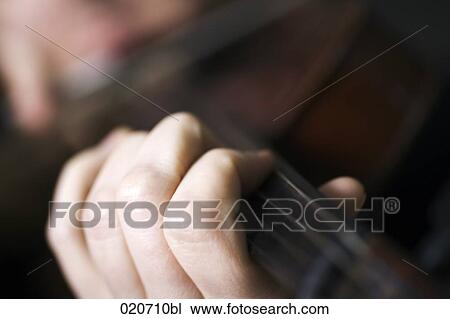 close-up of woman playing violin View Large Photo Image Stock Image - close-up of woman playing violin. Fotosearch