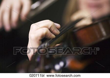 close-up of woman playing violin View Large Photo Image Stock Image - close-up of woman playing violin. Fotosearch