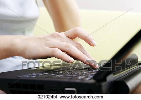close-up of young woman using laptop computer View Large Photo Image Stock Image - close-up of young woman using laptop computer. Fotosearch