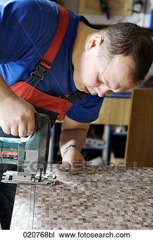 craftsman cutting wood with jigsaw View Large Photo Image Stock Image - craftsman cutting wood with jigsaw. Fotosearch