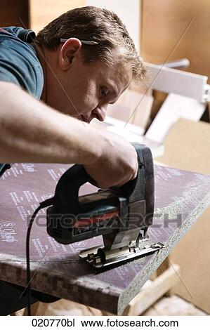 craftsman cutting wood with jigsaw View Large Photo Image Stock Image - craftsman cutting wood with jigsaw. Fotosearch