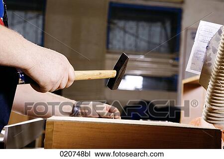 detail of craftsman assembling furniture using hammer and nail View Large Photo Image Stock Image - detail of craftsman assembling furniture using hammer and nail. Fotosearch