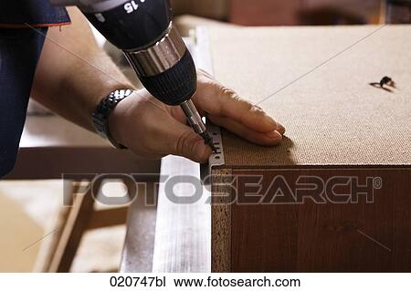 detail of craftsman assemblingf furniture with cordless screwdriver View Large Photo Image Stock Image - detail of craftsman assemblingf furniture with cordless screwdriver. Fotosearch