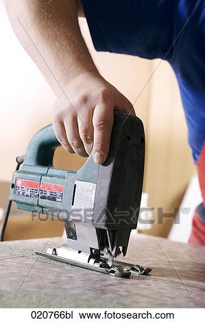 detail of craftsman cutting wood with jigsaw View Large Photo Image Stock Image - detail of craftsman cutting wood with jigsaw. Fotosearch