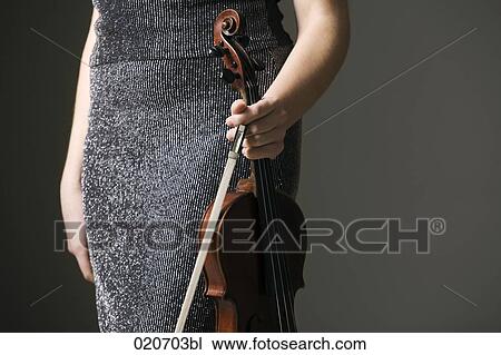 detail of female violinst holding instrument and bow View Large Photo Image Stock Image - detail of female violinst holding instrument and bow. Fotosearch