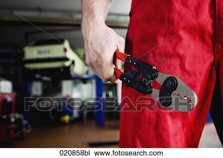 detail of mechanic holding tongs View Large Photo Image Stock Image - detail of mechanic holding tongs. Fotosearch