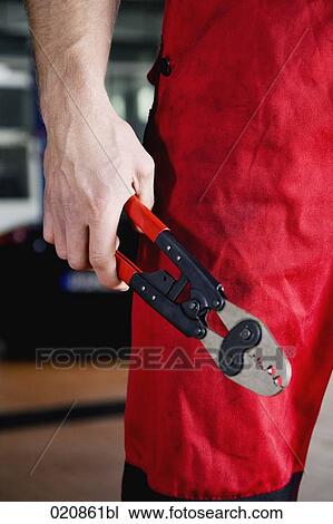 detail of mechanic holding tongs View Large Photo Image Stock Image - detail of mechanic holding tongs. Fotosearch