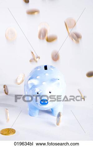 euro coins raining down on blue piggybank View Large Photo Image Stock Image - euro coins raining down on blue piggybank. Fotosearch