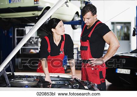 female and male mechanic having discussion in garage View Large Photo Image Stock Image - female and male mechanic having discussion in garage. Fotosearch