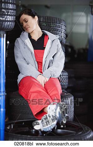 female mechanic having a nap in garage View Large Photo Image Stock Image - female mechanic having a nap in garage. Fotosearch