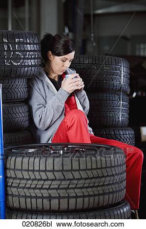 female mechanic having a nap in garage View Large Photo Image Stock Image - female mechanic having a nap in garage. Fotosearch