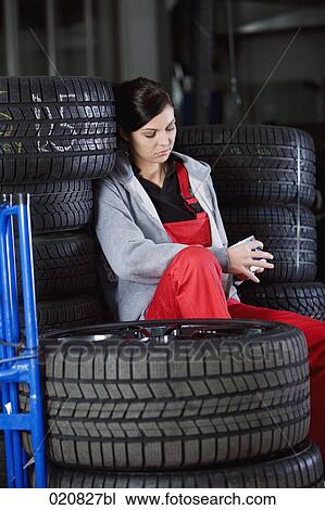 female mechanic having a nap in garage View Large Photo Image Stock Image - female mechanic having a nap in garage. Fotosearch