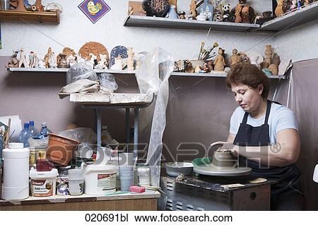 female potter working in her workshop View Large Photo Image Stock Image - female potter working in her workshop. Fotosearch