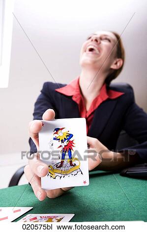 happy young woman holding joker card View Large Photo Image Stock Image - happy young woman holding joker card. Fotosearch
