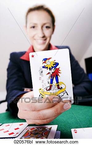 happy young woman holding joker card View Large Photo Image Stock Image - happy young woman holding joker card. Fotosearch