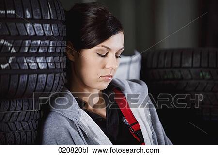 headshot of female mechanic having a nap in garage View Large Photo Image Stock Image - headshot of female mechanic having a nap in garage. Fotosearch