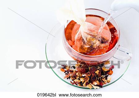 hot water being poured into cup for fruit tea View Large Photo Image Stock Image - hot water being poured into cup for fruit tea. Fotosearch