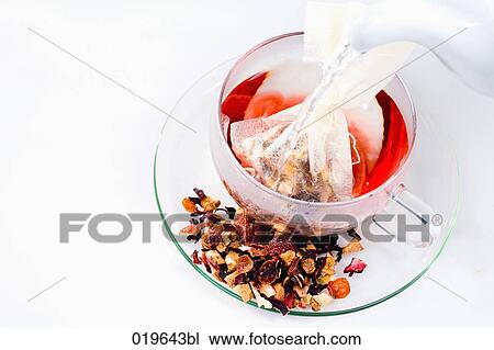 hot water being poured into cup for fruit tea View Large Photo Image Stock Image - hot water being poured into cup for fruit tea. Fotosearch