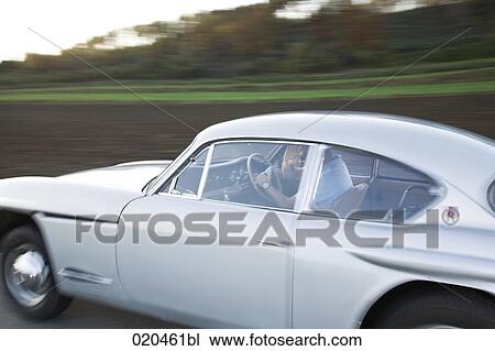 man driving classic car View Large Photo Image Stock Image - man driving classic car. Fotosearch