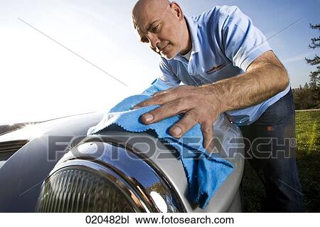man polishing his classic car with cloth View Large Photo Image Stock Image - man polishing his classic car with cloth. Fotosearch