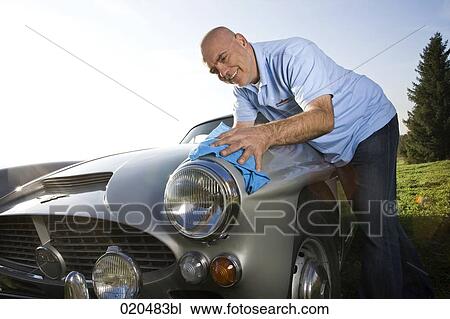 man polishing his classic car with cloth View Large Photo Image Stock Image - man polishing his classic car with cloth. Fotosearch
