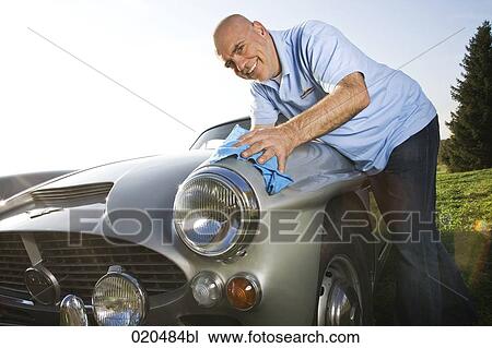 man polishing his classic car with cloth View Large Photo Image Stock Image - man polishing his classic car with cloth. Fotosearch