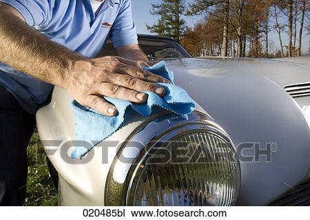 man polishing his classic car with cloth View Large Photo Image Stock Image - man polishing his classic car with cloth. Fotosearch