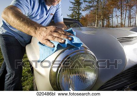 man polishing his classic car with cloth View Large Photo Image Stock Image - man polishing his classic car with cloth. Fotosearch